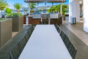 Thumbnail 14 of 30 - Community Outdoor Grill Area at AV8 Apartments in San Diego, CA