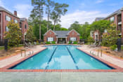 Thumbnail 14 of 28 - a swimming pool with a house in the background at Villages of Cypress Creek, Houston, Texas