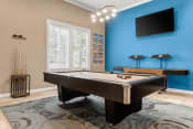 Thumbnail 20 of 28 - a game room with a pool table and a tv at Villages of Cypress Creek, Houston, Texas