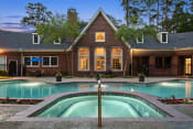 Thumbnail 15 of 28 - a house with a swimming pool in front of it at Villages of Cypress Creek, Houston, Texas