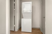 Thumbnail 6 of 24 - a white washer and dryer in a room with a door at South Lamar Village, Austin, TX