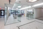 Thumbnail 27 of 41 - a large lobby with glass walls and a marble floor at The Parker Apartments, Oregon