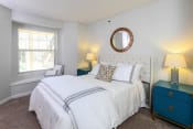 Thumbnail 8 of 17 - a bedroom with a white bed and a window at Verdant, Boulder