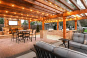 Thumbnail 12 of 17 - a patio with a table and chairs under a pavilion with lights at Verdant, Boulder, CO, 80303