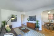 Thumbnail 6 of 12 - a living room with a couch and a coffee table