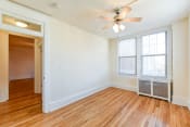 Thumbnail 12 of 20 - vacant bedroom with hardwood flooring and ceiling fan at the cortland apartments in washington dc