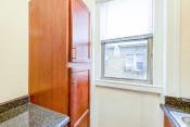 Thumbnail 2 of 24 - kitchen with modern cabinetry and window at chatham courts apartments in washington dc