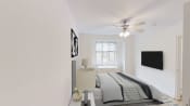 Thumbnail 8 of 36 - bedroom with bed, nightstands, large window and ceiling fan at 2800 woodley apartments in washington dc