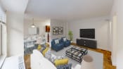 Thumbnail 5 of 36 - living area with sofa, coffee table, credenza, tv, and hardwood floors at 2800 woodley apartments in washington dc