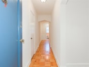 Thumbnail 6 of 14 - apartments unit hallway with hardwood floors at 1400 van buren apartments in washington dc