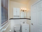 Thumbnail 8 of 17 - bathroom with toilet, vanity, medicine cabinet, mirror and large window at 2801 Pennsylvania apartments in washington dc