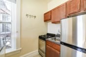 Thumbnail 12 of 34 - kitchen with stainless steel appliances and large window at dupont apartments in washington dc
