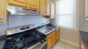 Thumbnail 19 of 30 - kitchen at hampton courts apartments in dc with stainless steel appliances