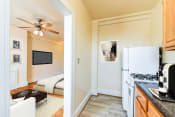 Thumbnail 4 of 20 - kitchen with gas range, wood cabinetry and energy efficient appliances at the foreland apartments in washinton dc