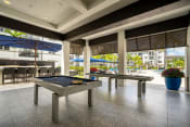 Thumbnail 44 of 59 - a pool table in the lobby of a building with pool tables