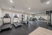 Thumbnail 29 of 48 - the gym is equipped with treadmills and other fitness equipment at Monterra Ridge Apartments, California,91351