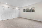 Thumbnail 9 of 40 - an empty room with three closets and a window