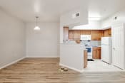 Thumbnail 3 of 16 - a kitchen and living room with a hardwood floor