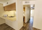 Thumbnail 5 of 29 - Kitchen and hallway at University Park in Tempe AZ August 2020