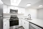 Thumbnail 15 of 47 - Kitchen at The Grove at Tramway Apartments in Albuquerque New Mexico