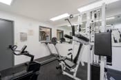 Thumbnail 20 of 41 - apartment fitness center with weight and cardio equipment