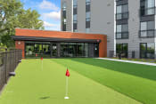Thumbnail 45 of 82 - a putting green in front of a building