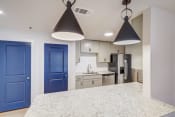 Thumbnail 5 of 14 - a kitchen with blue doors and a white counter top