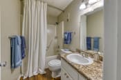 Thumbnail 9 of 32 - bathroom with wood-style floors at Ascent Jones Apartments in Huntsville, Alabama