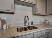 Thumbnail 19 of 41 - Stainless Steel Sink With Faucet In Kitchen at The Tower Apartments, Alabama