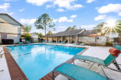 Thumbnail 10 of 24 - swimming pool with lounge chairs at Retreat at Brightside Apartments in Baton Rouge, LA