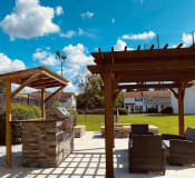 Thumbnail 20 of 32 - Grilling station and pergola at Ascent Jones Apartments in Huntsville, Alabama