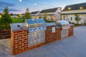Thumbnail 24 of 47 - two stainless steel barbecue grills at Anthem Apartments and Cottages in Huntsville, Alabama
