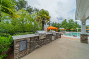 Thumbnail 17 of 21 - the preserve at ballantyne commons concierge desk and pool area with trees