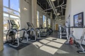 Thumbnail 39 of 60 - Fitness center with cardio equipment