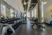 Thumbnail 40 of 60 - Fitness center with cardio equipment, strength training equipment, and free weights