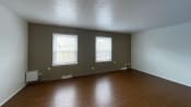 Thumbnail 18 of 22 - Spacious living room with plank at Woodland Pointe Apartments and Townhomes, Integrity Realty, Kent, OH style floors