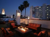 Thumbnail 11 of 23 - Beautiful nighttime view of rooftop patio with gas firepit and view of Franklin below.