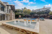 Thumbnail 40 of 50 - the preserve at ballantyne commons pool with water feature and lounge chairs
