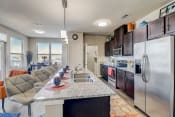 Thumbnail 4 of 50 - a kitchen with stainless steel appliances and a granite counter top