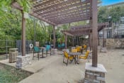 Thumbnail 44 of 50 - a patio with tables and chairs and a pergola