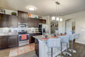 Thumbnail 3 of 50 - a kitchen with stainless steel appliances and a table with chairs