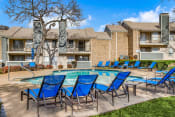 Thumbnail 1 of 12 - our apartments have a swimming pool and lounge chairs  at 1505 Exchange Apartments, Fort Worth, 76112