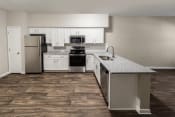 Thumbnail 26 of 31 - a kitchen with white cabinets and stainless steel appliances