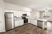 Thumbnail 27 of 31 - a kitchen with white cabinets and stainless steel appliances