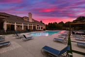 Thumbnail 1 of 27 - swimming pool with clubhouse in the background at sunset  at Butternut Ridge, North Olmsted, OH