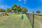 Thumbnail 70 of 94 - a chain link fence with a grassy field behind it and trees at Discovery at Craig Ranch, McKinney, TX