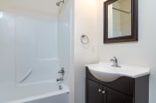 Thumbnail 17 of 18 - bathroom with single vanity and sink. Tub and shower combo.