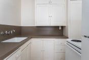 Thumbnail 18 of 33 - The Shannon | #307 Kitchen with White Cabinetry and Appliances