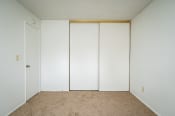 Thumbnail 15 of 22 - an empty room with white walls and a carpet
