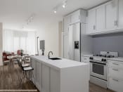 Thumbnail 2 of 10 - a kitchen with white cabinets and a white counter top